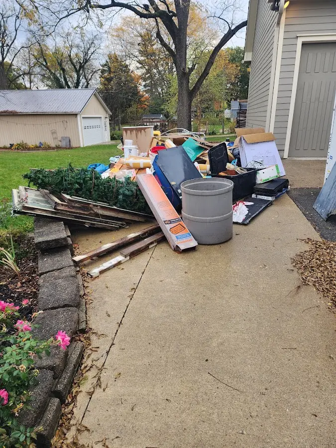 Dumpster being loaded with debris for Commercial Dumpster Rental in West Menlo Park